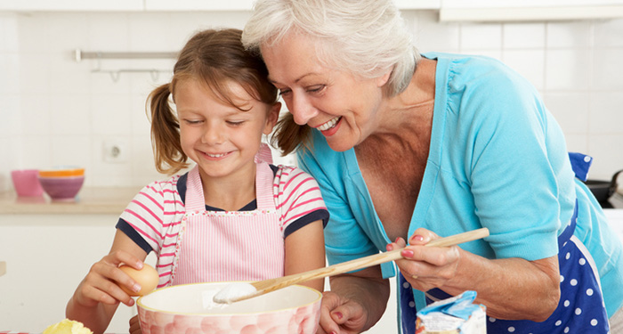 grandmother baking with grandchild